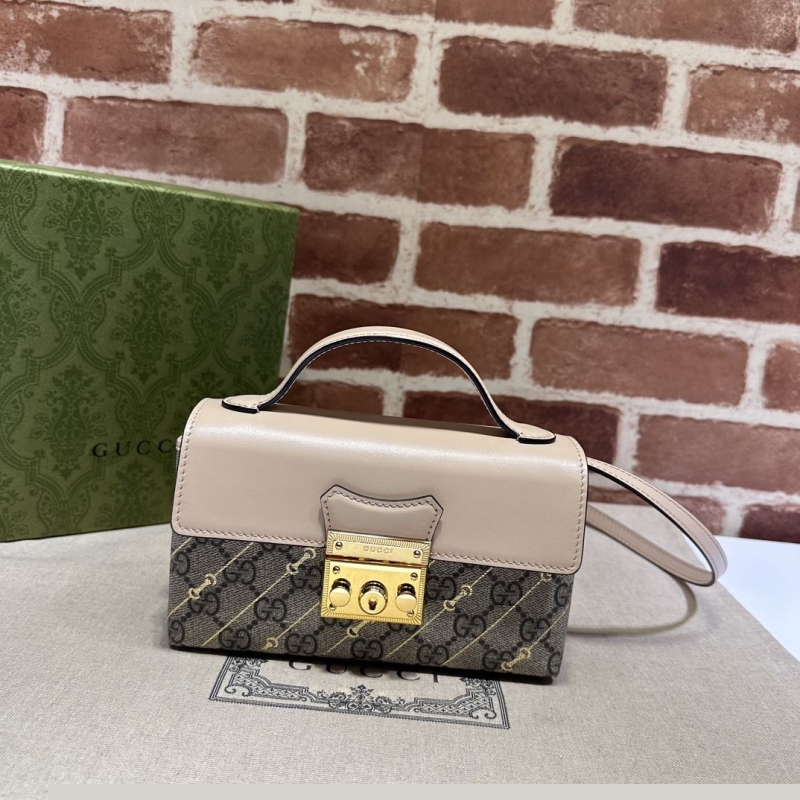 G*u*i top handle bags